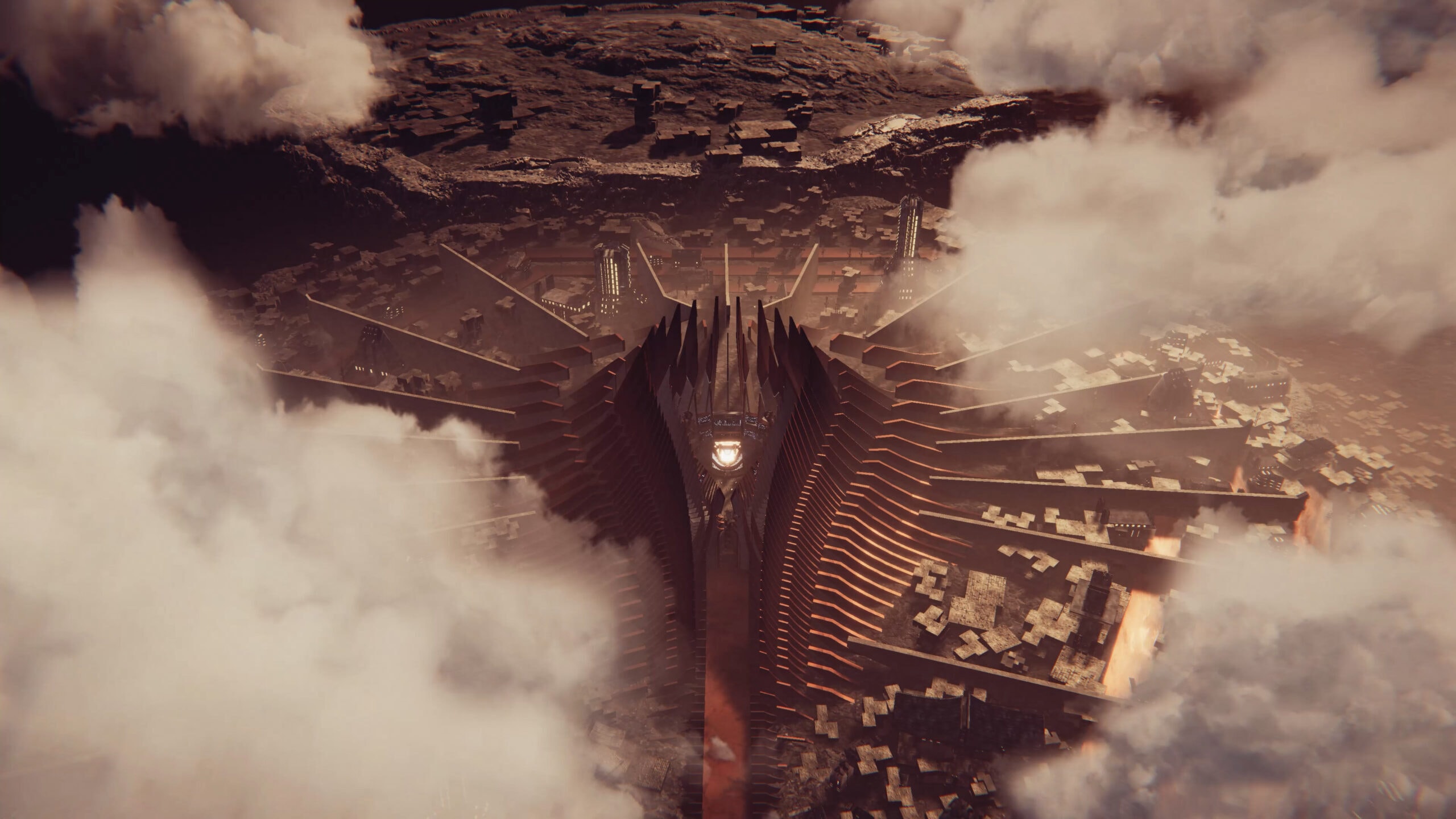 Aerial view of massive monolithic stage rising through clouds