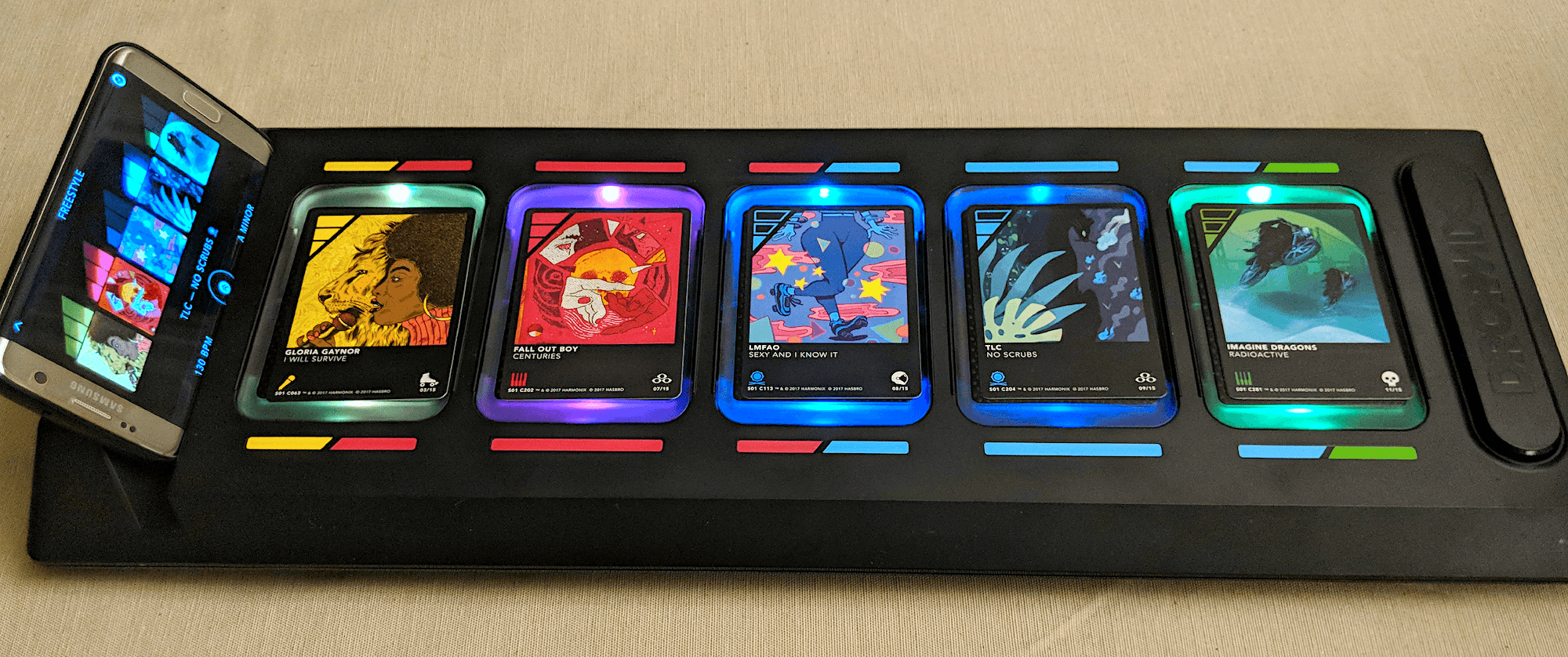 DropMix physical board with smartphone and cards